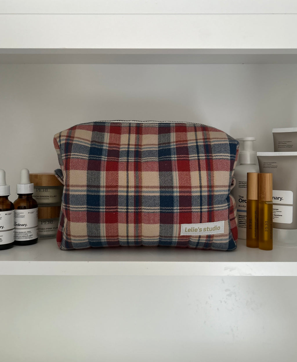 Brown, red and blue makeup bag