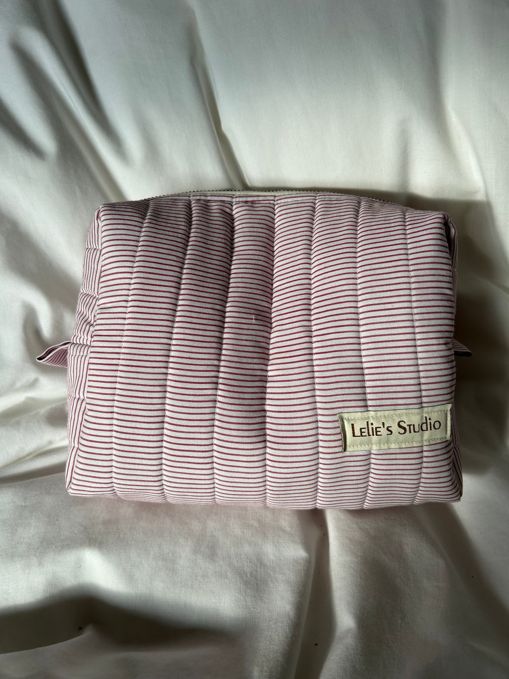 White and red striped makeup bag