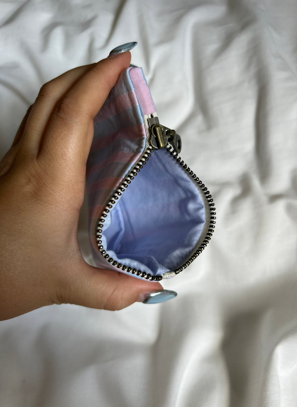 Pink and blue striped coin purse