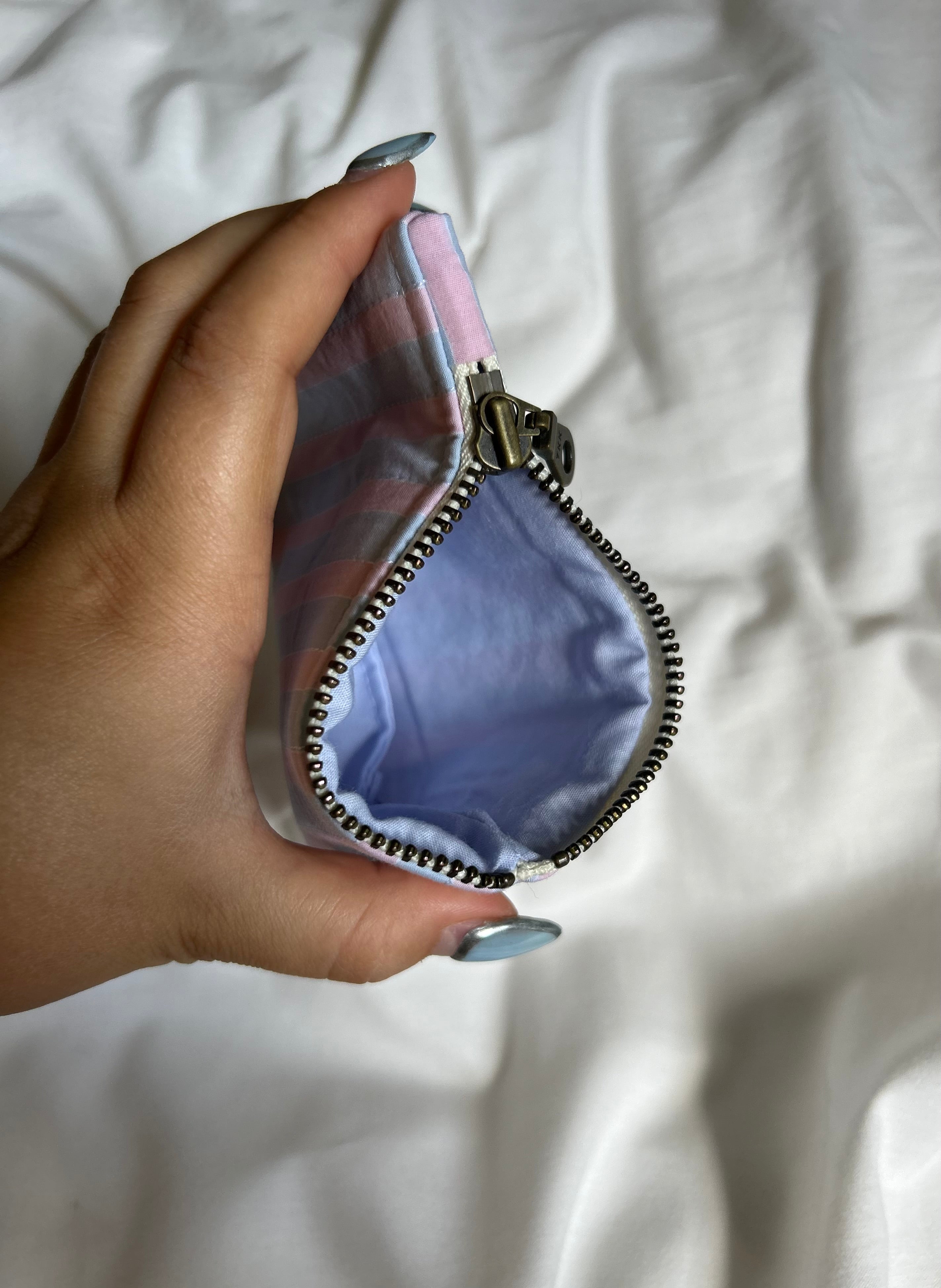Pink and blue striped coin purse
