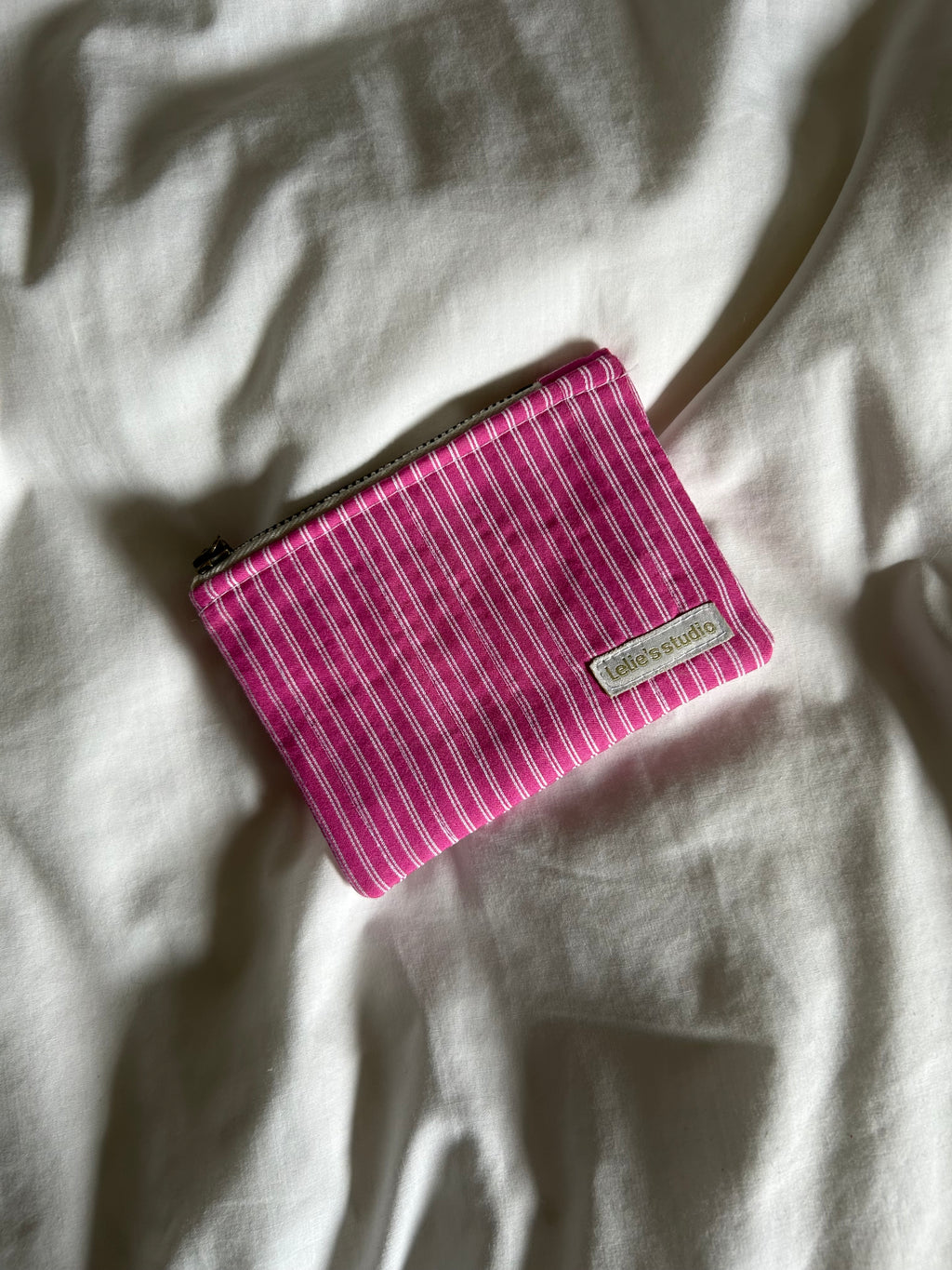 Pink and white striped coin purse