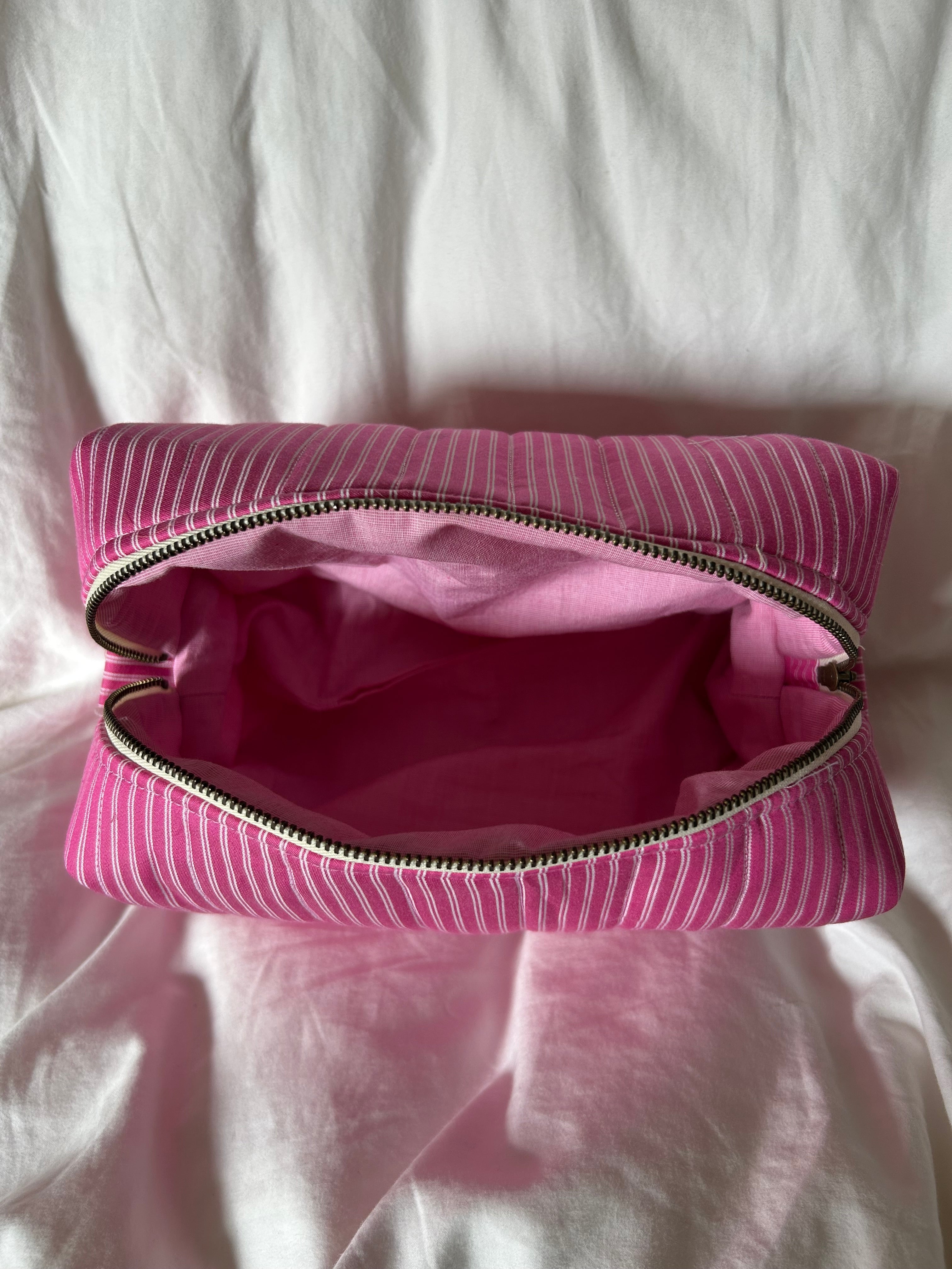 Pink and white makeup bag