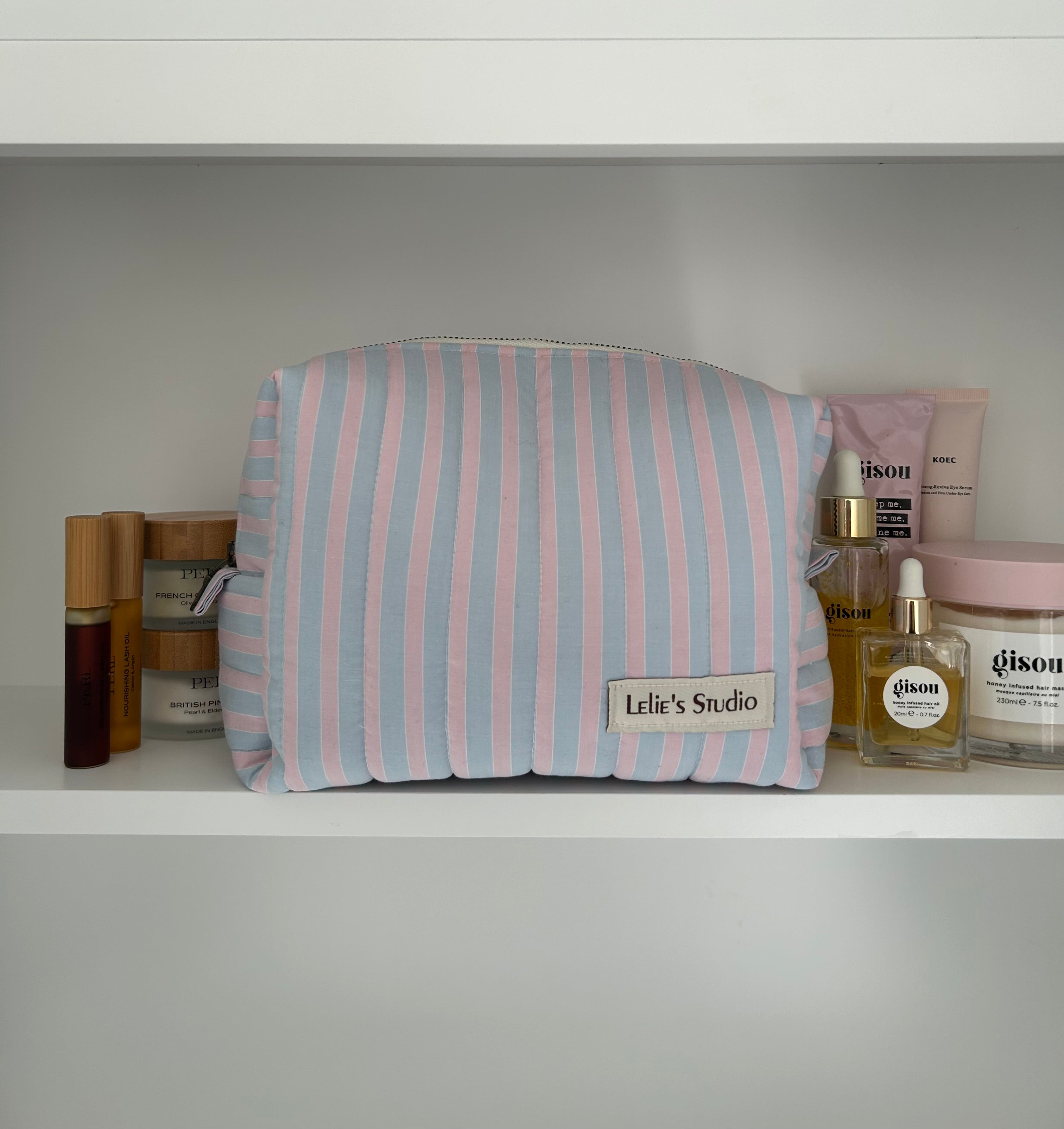 Blue and pink striped makeup bag