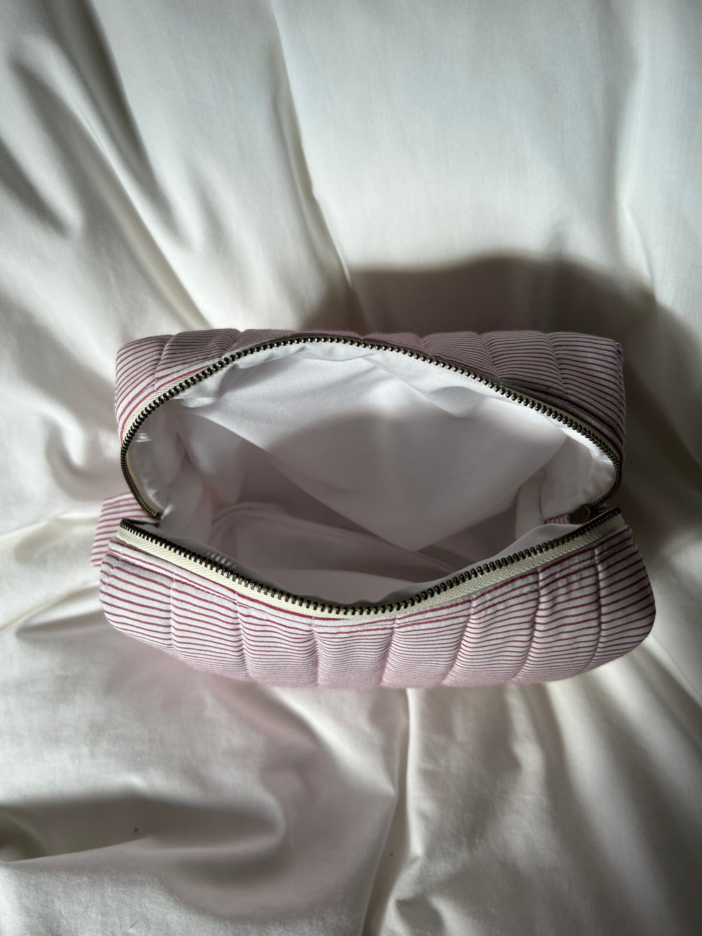 White and red striped makeup bag