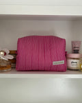 Pink and white makeup bag