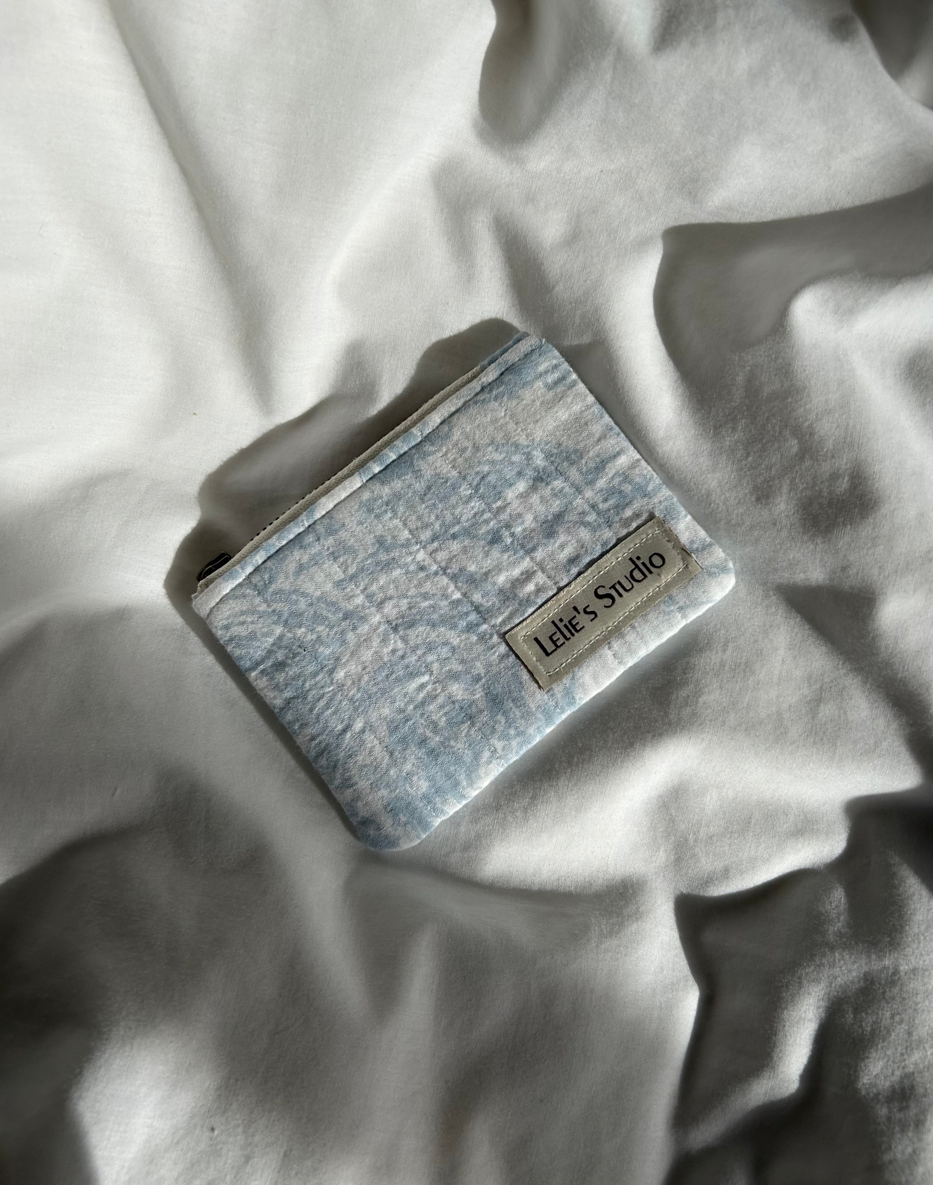 Blue and white coin patterned purse