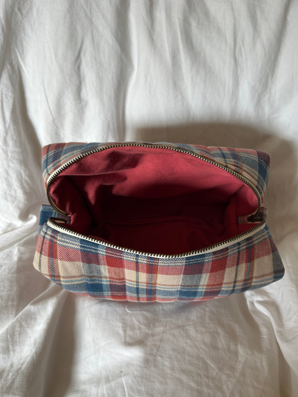 Brown, red and blue makeup bag