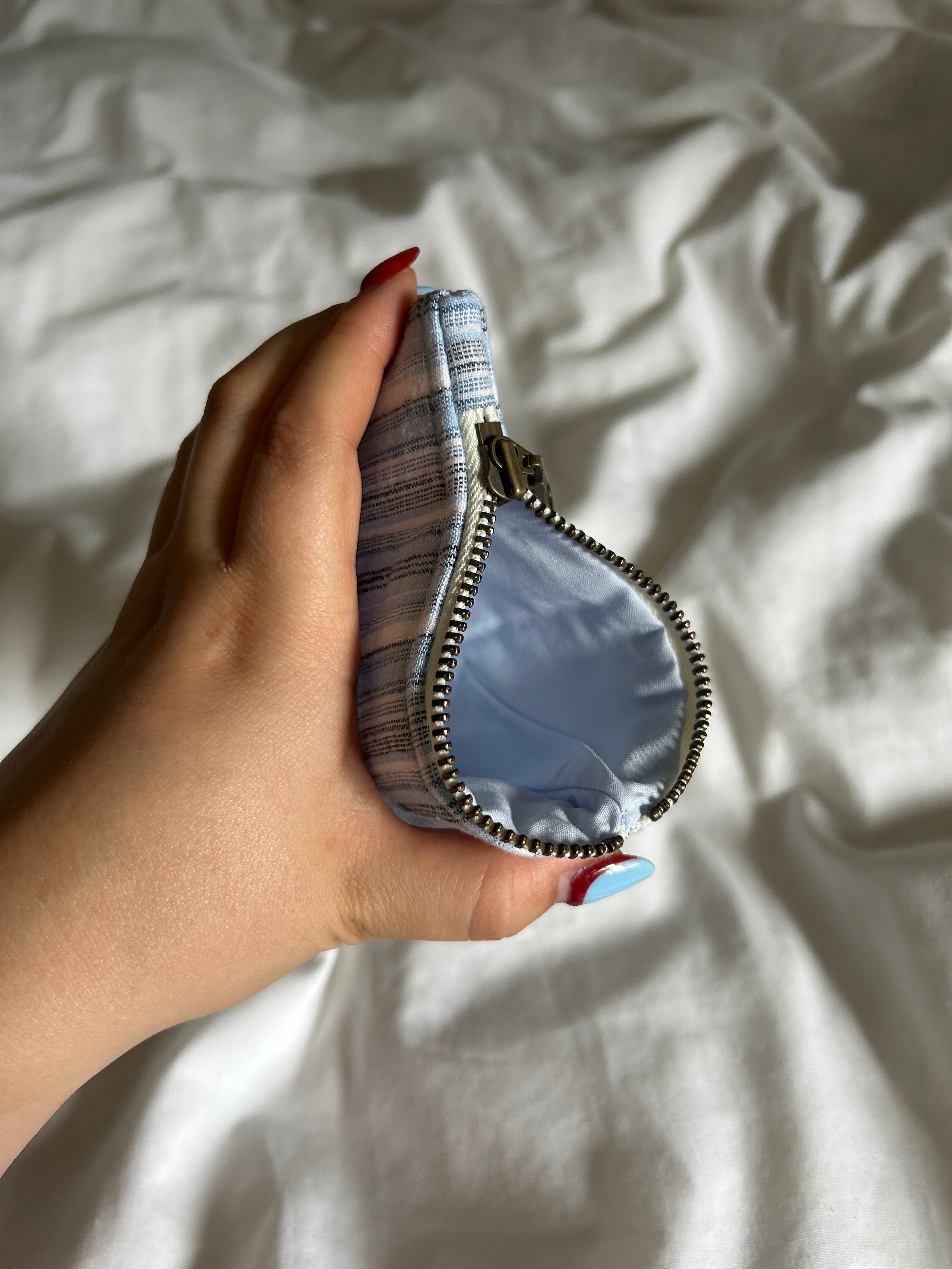 Light blue and white striped coin purse