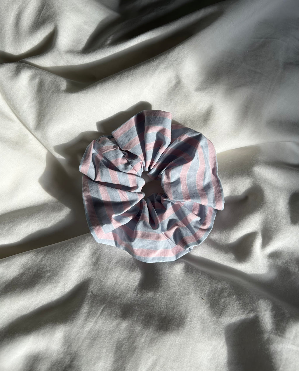 Pink and blue striped scrunchie