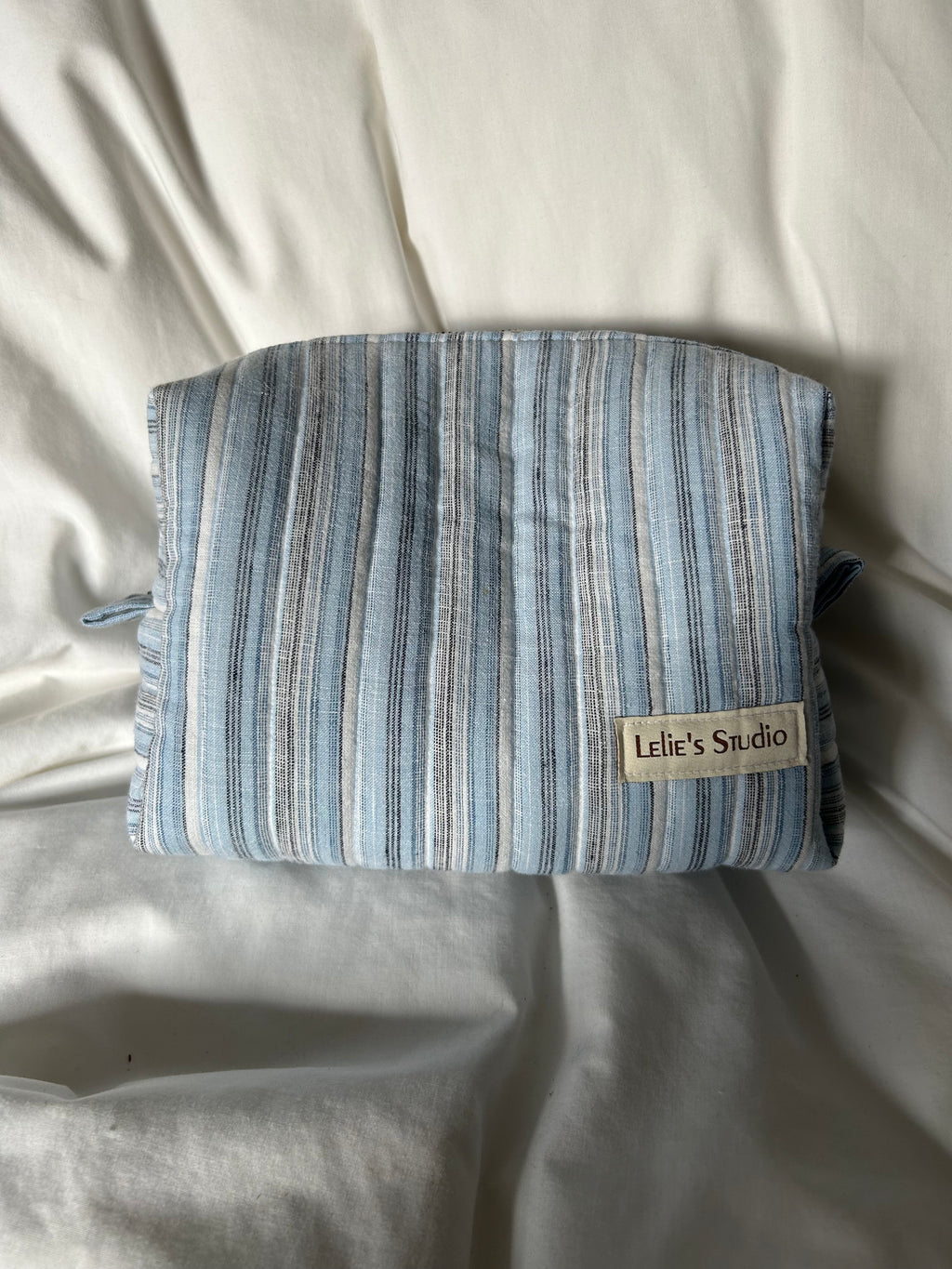 Blue, black and white makeup bag