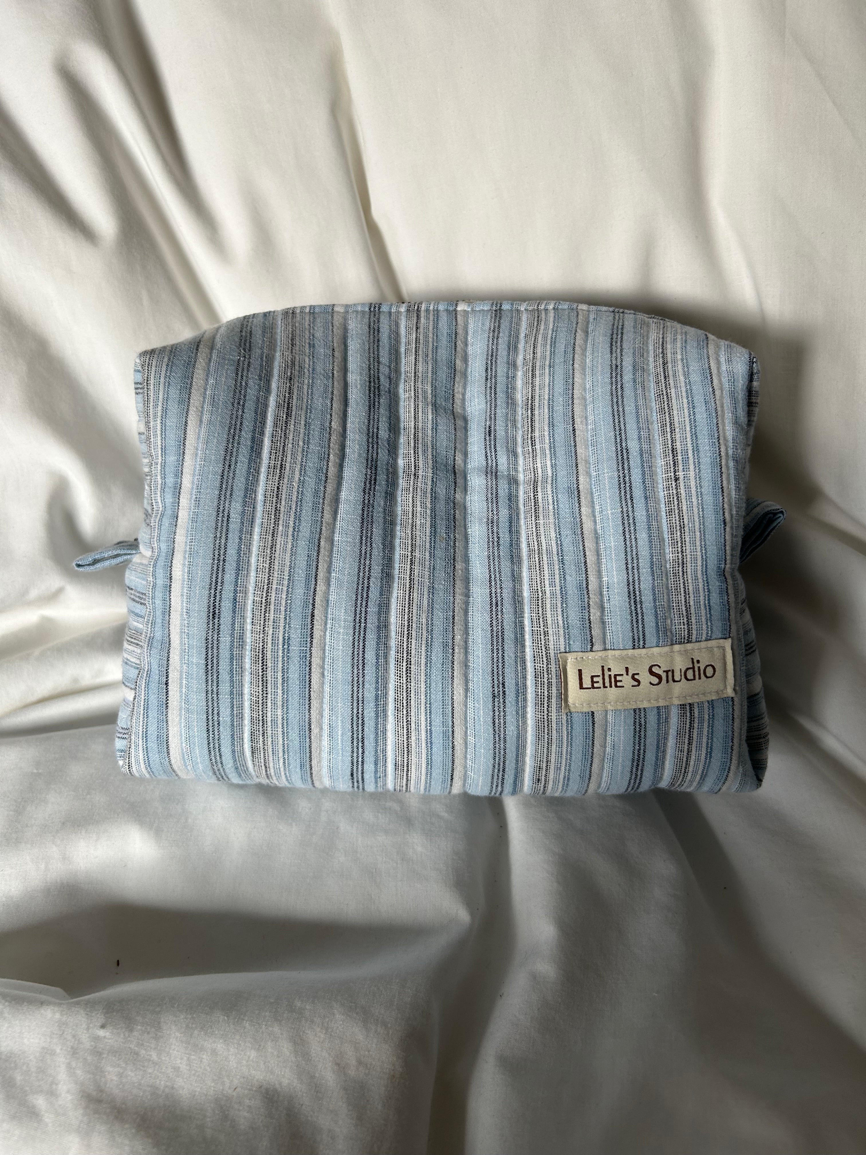 Blue, black and white makeup bag