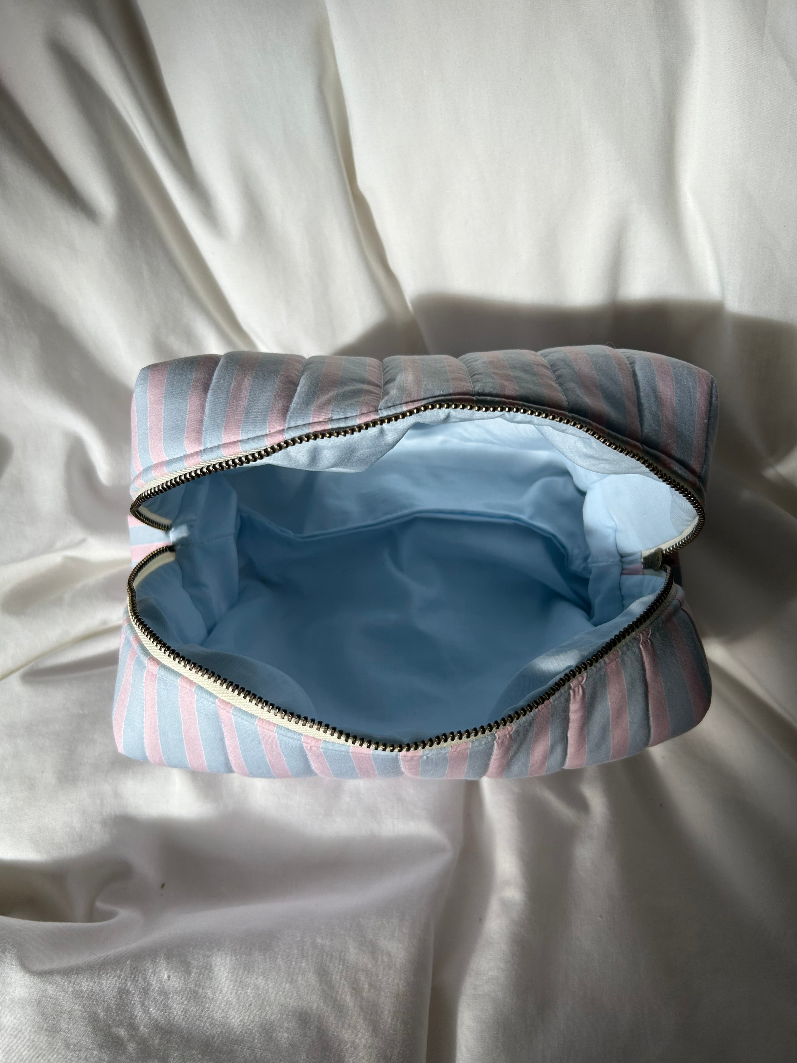 Blue and pink striped makeup bag