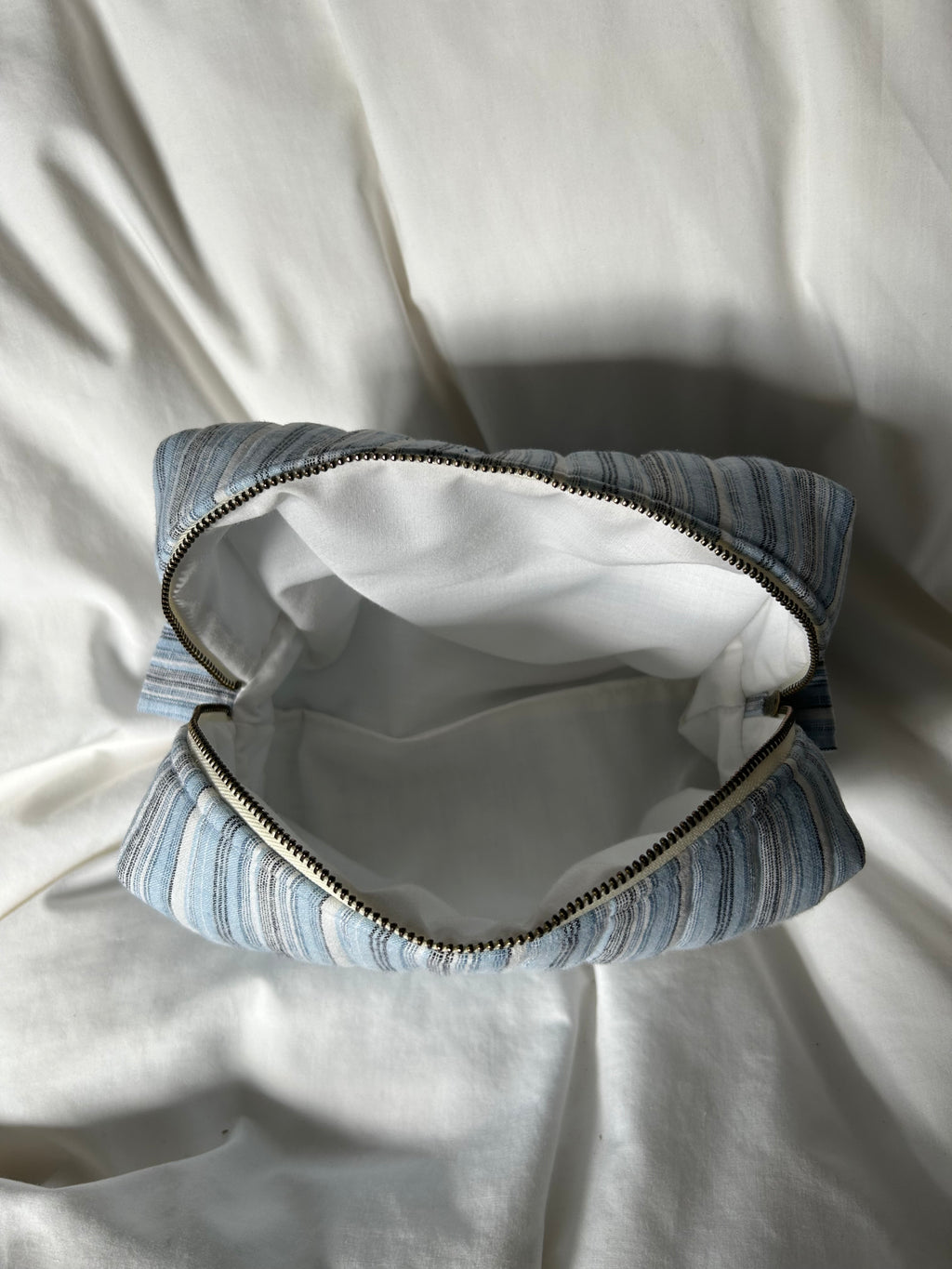 Blue, black and white makeup bag