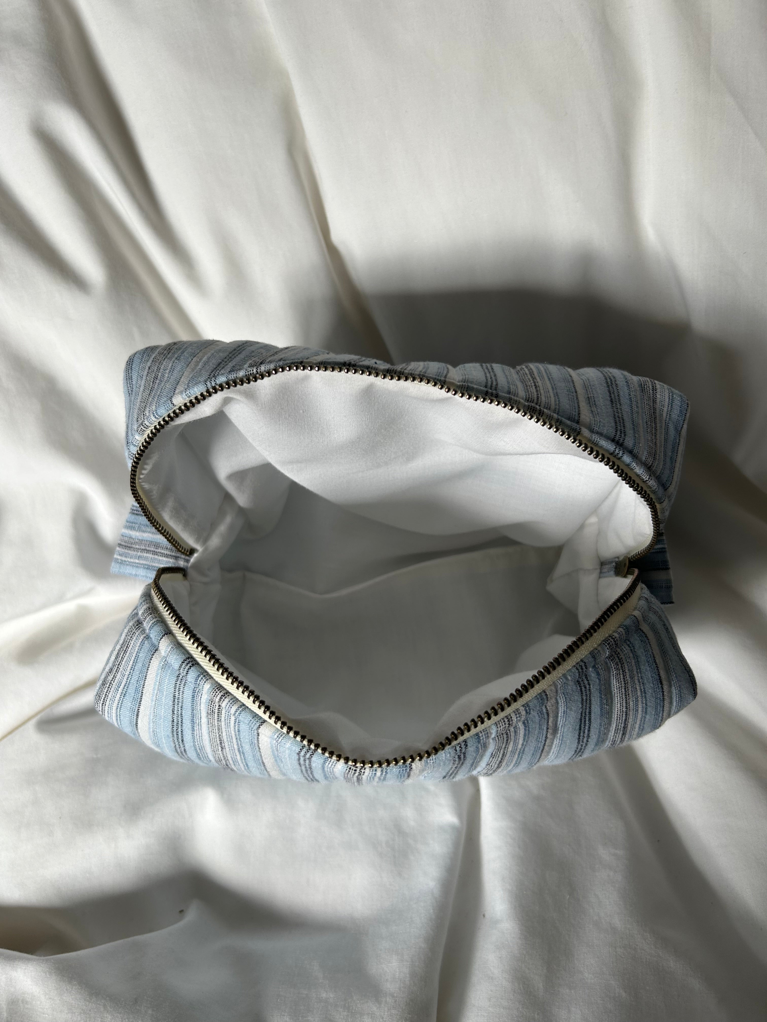 Blue, black and white makeup bag
