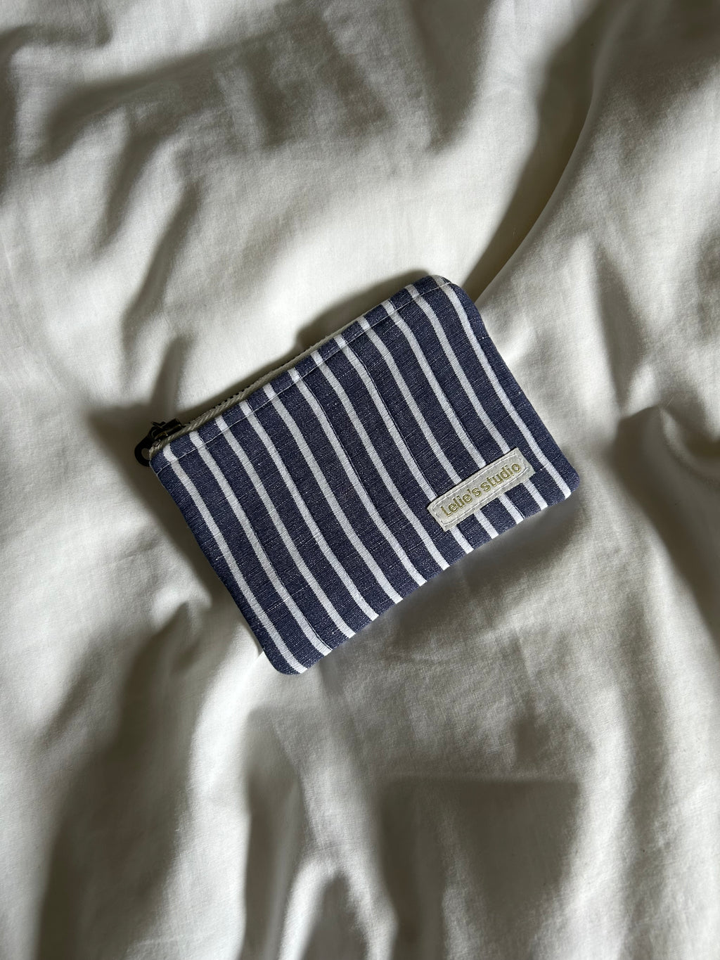 Blue and white striped coin purse