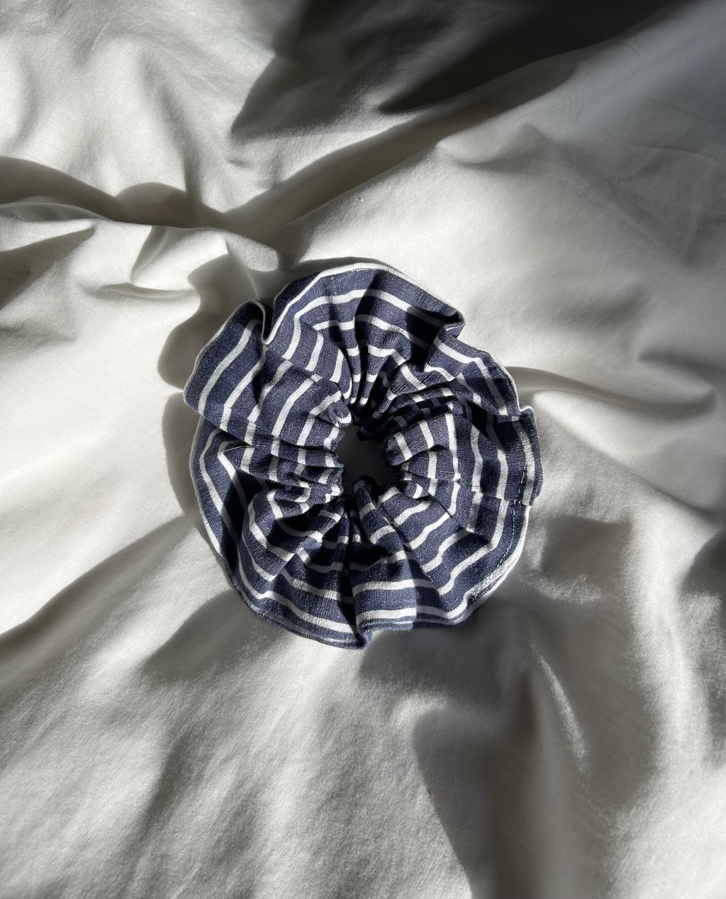 Blue and white striped scrunchie