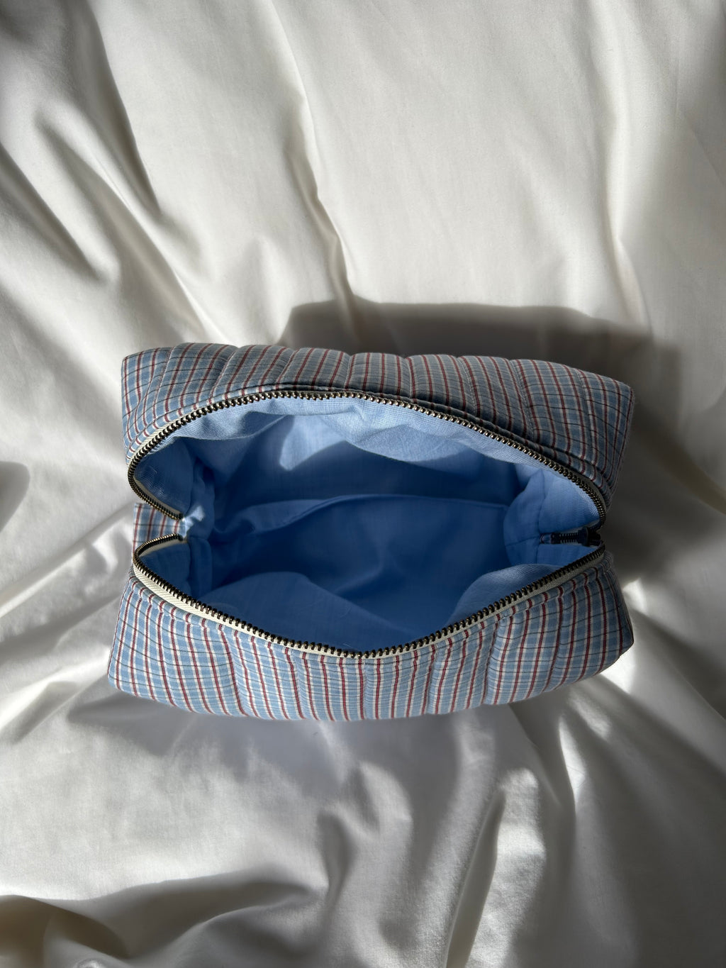 Blue and brown makeup bag