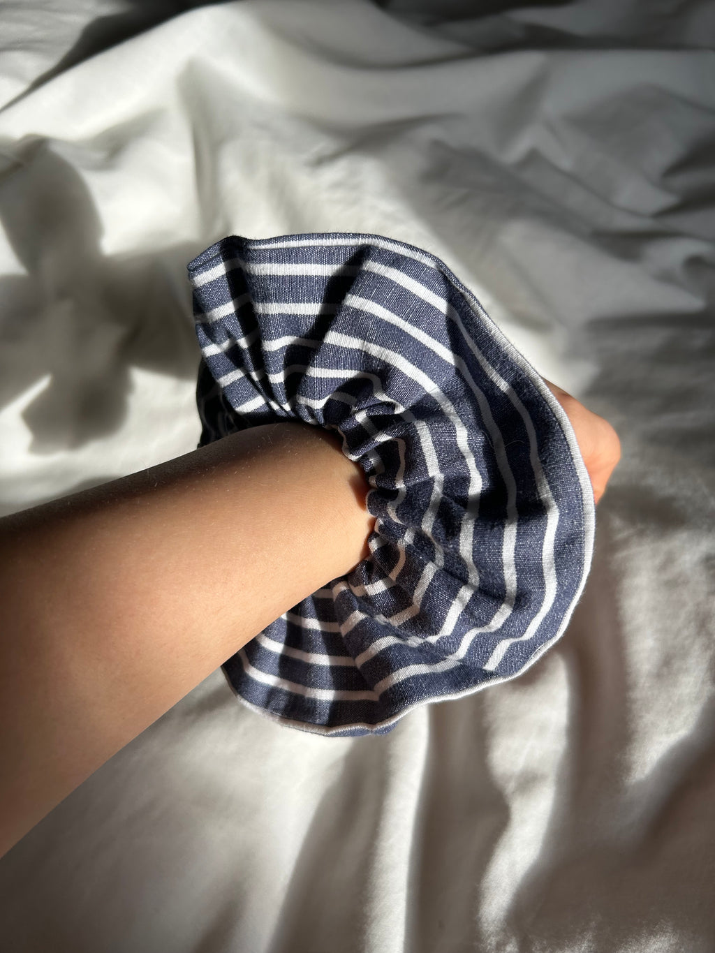 Blue and white striped scrunchie