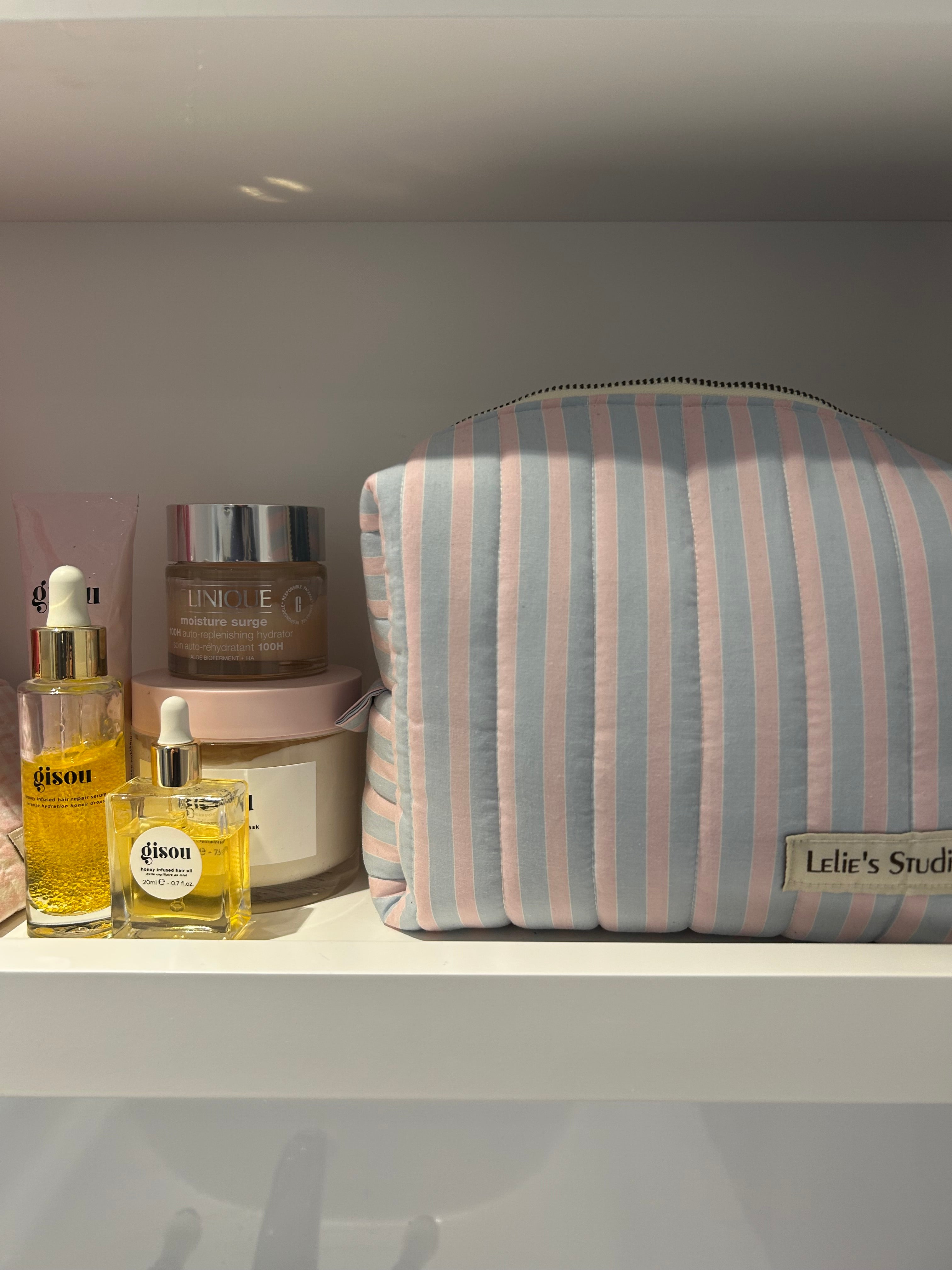 Blue and pink striped makeup bag