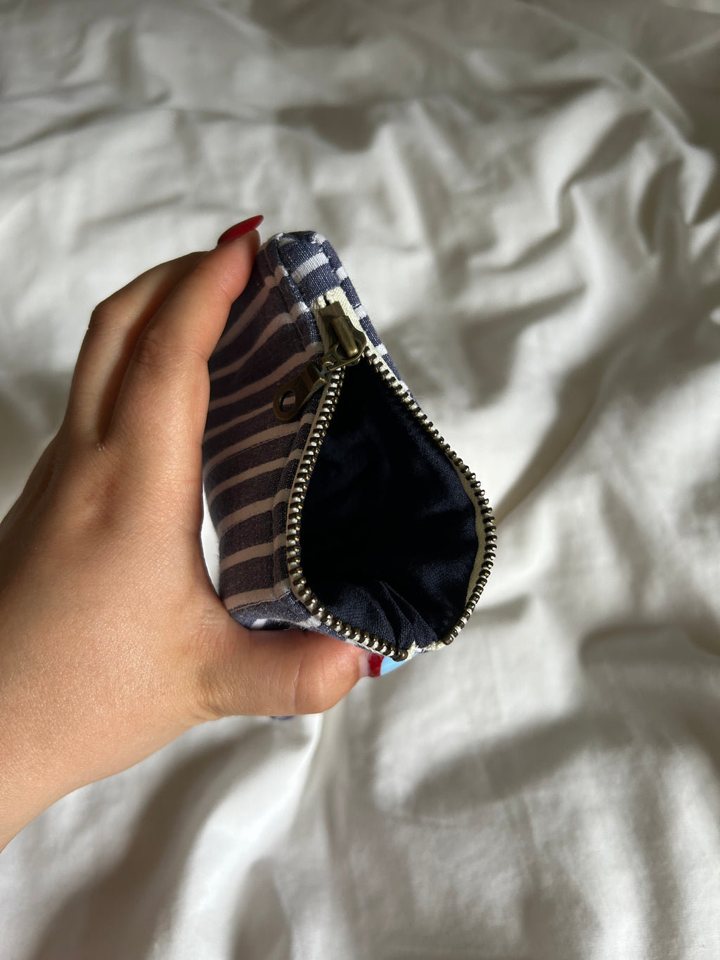 Blue and white striped coin purse