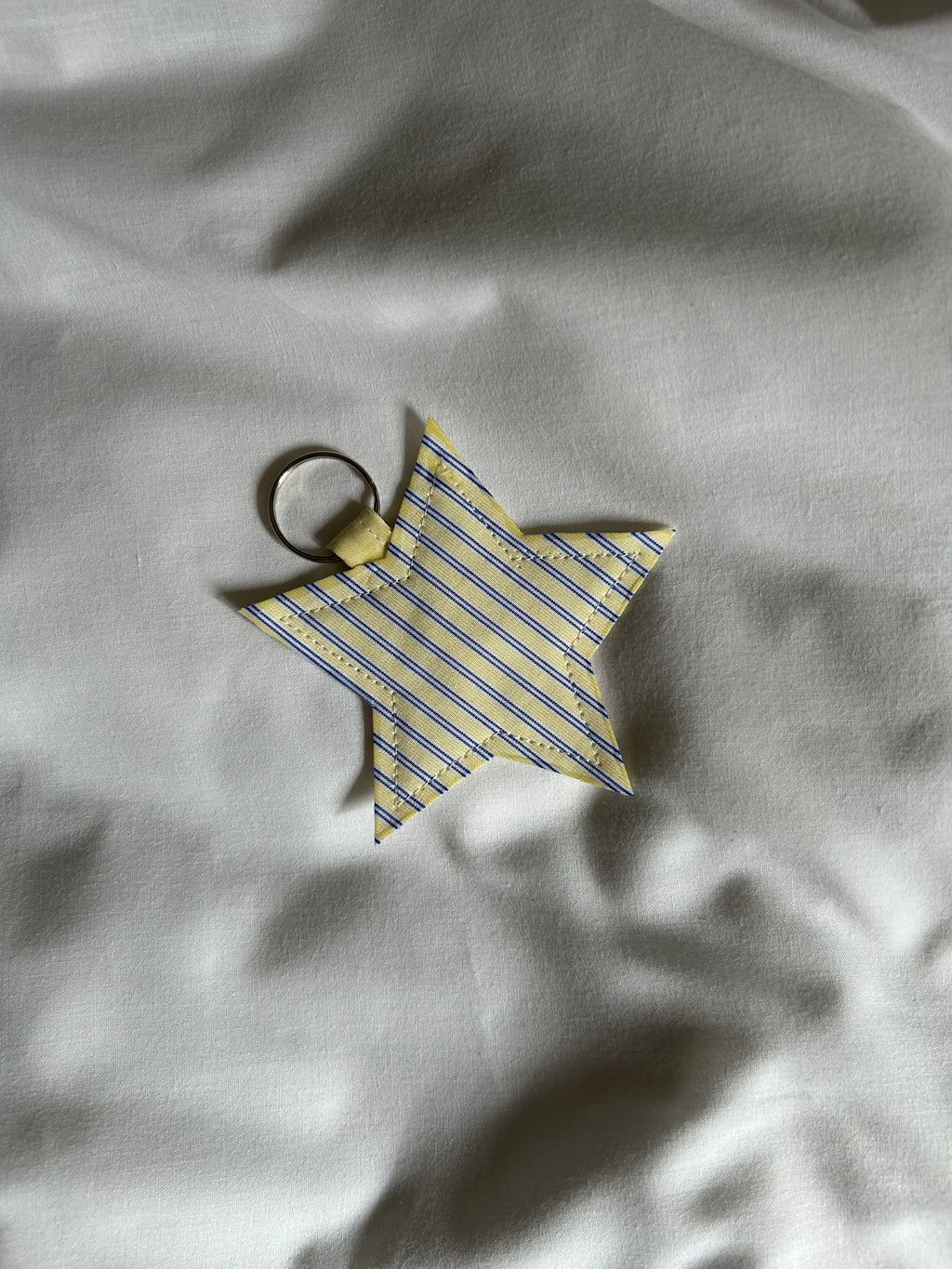 Yellow and blue striped star keyring