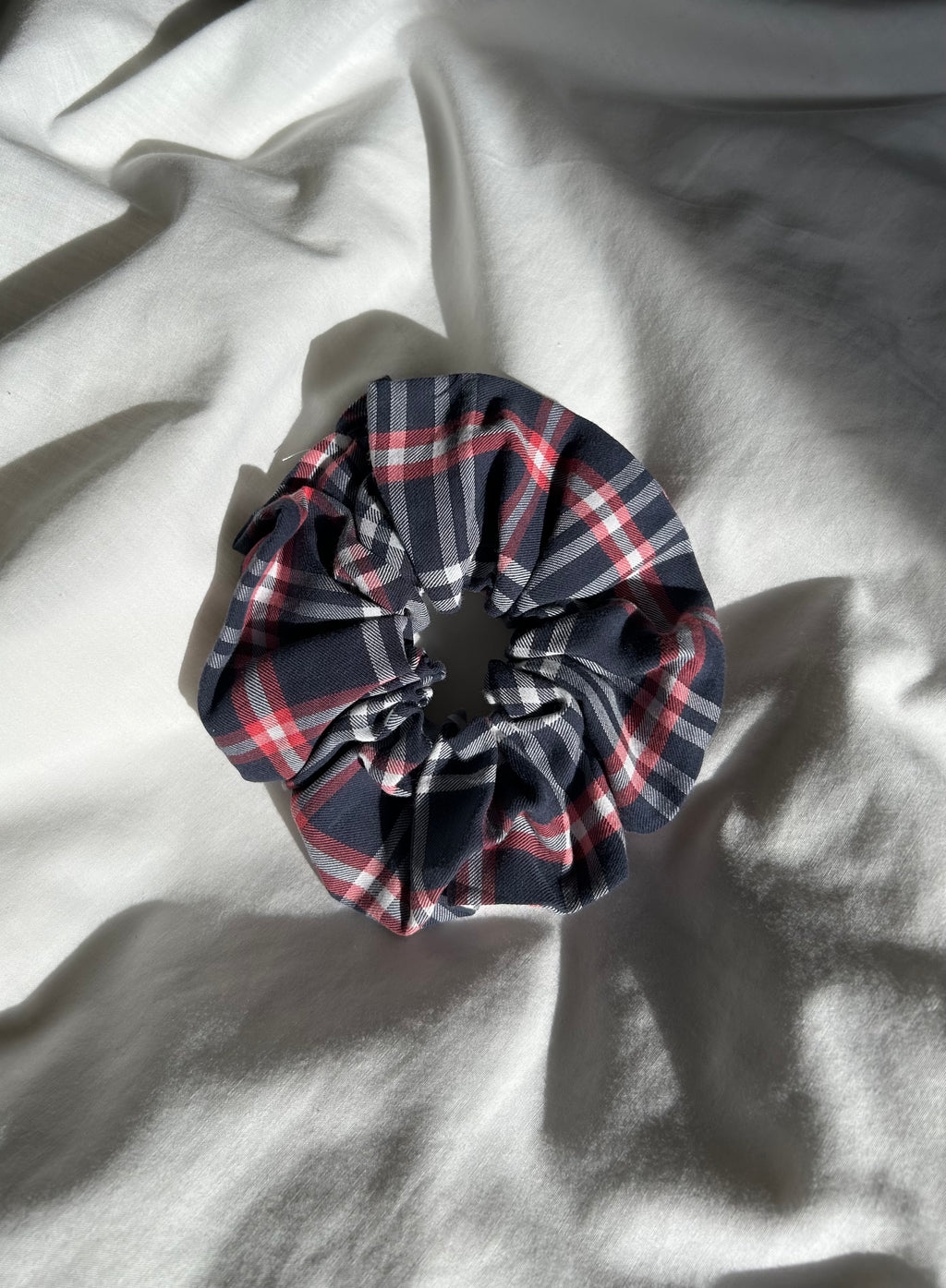Blue, white and red plaid scrunchie