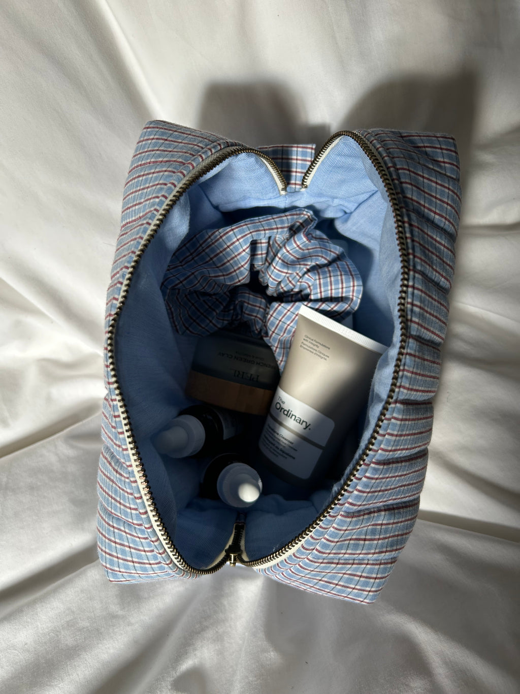 Blue and brown makeup bag