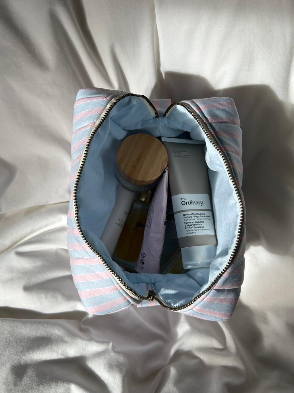Blue and pink striped makeup bag