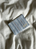 Light blue and white striped coin purse