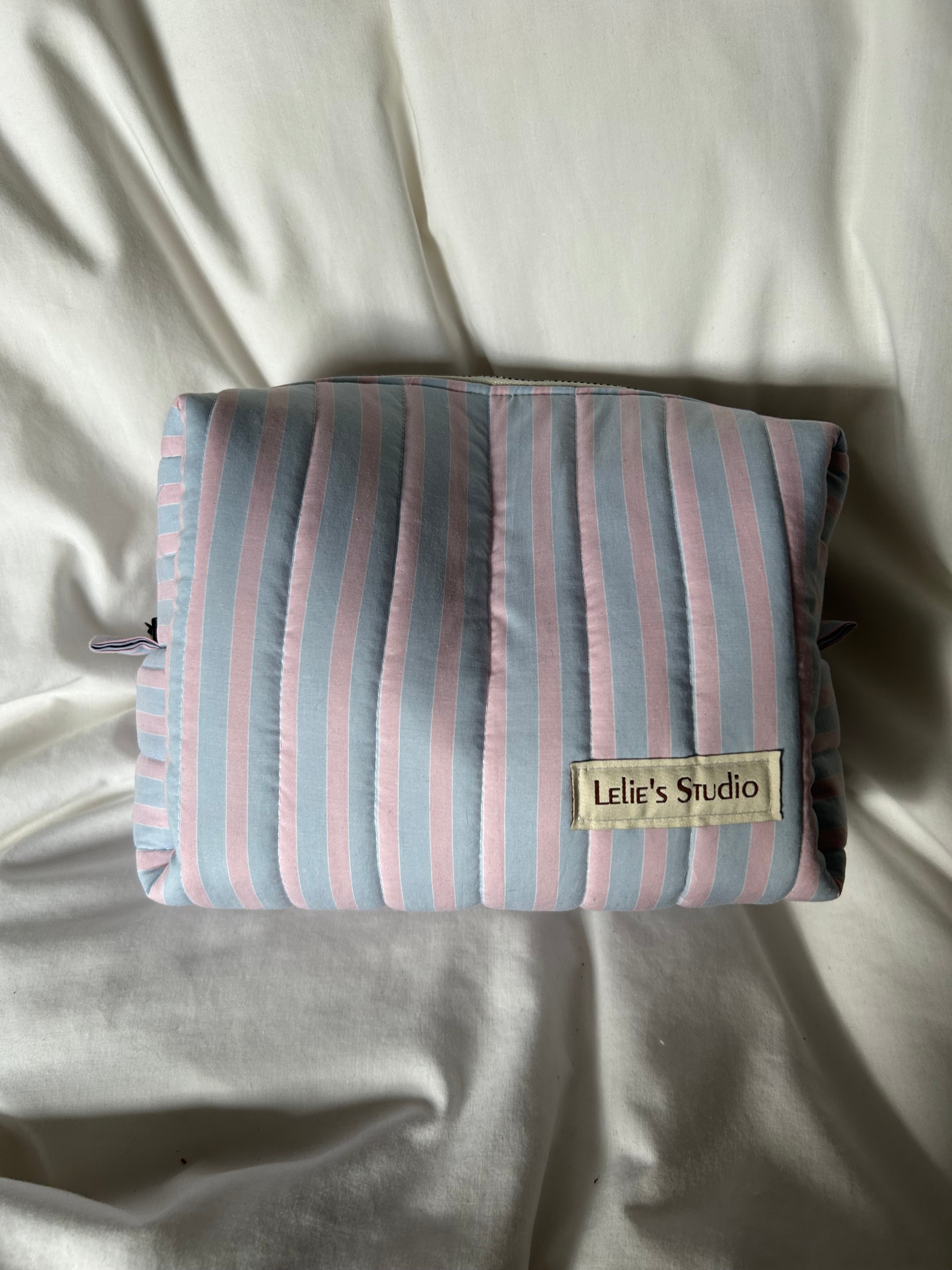 Blue and pink striped makeup bag